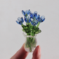 Set mit Miniatur-Blumenfiguren aus farbigem Glas